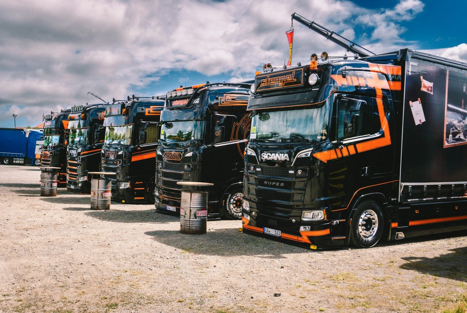 A row of semi trucks parked next to each other